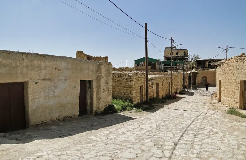 Old stone houses of Dana village on a cliff edge