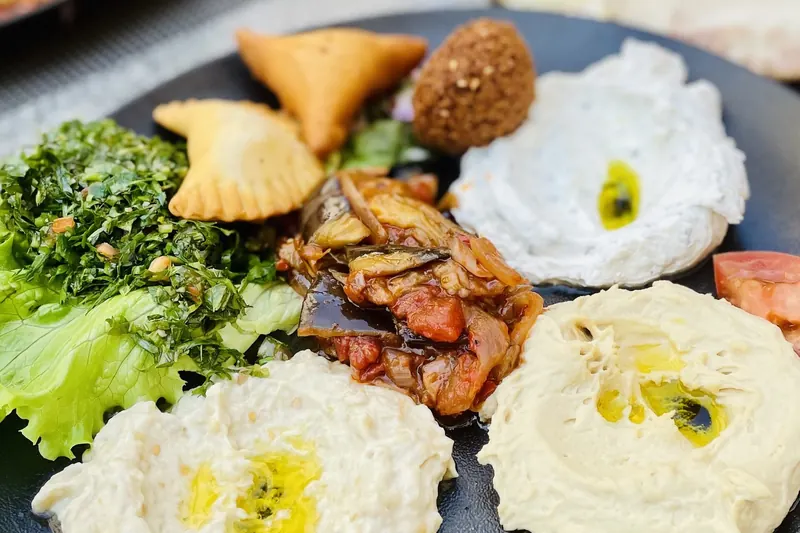 A spread of Lebanese mezze dishes on a table