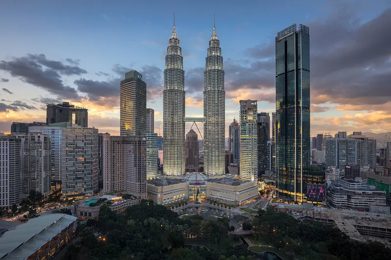The Petronas Towers rising over Kuala Lumpur at dusk