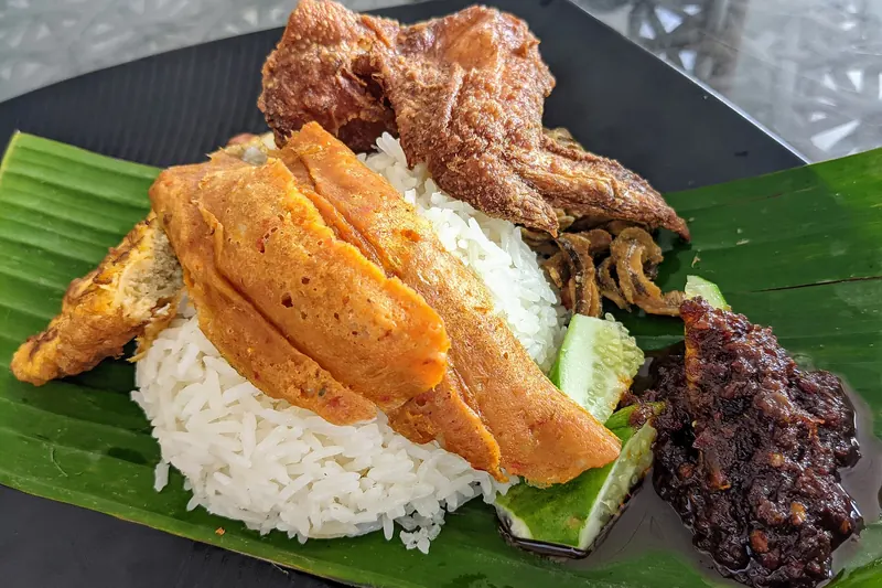 Nasi lemak, coconut rice served with sambal and sides