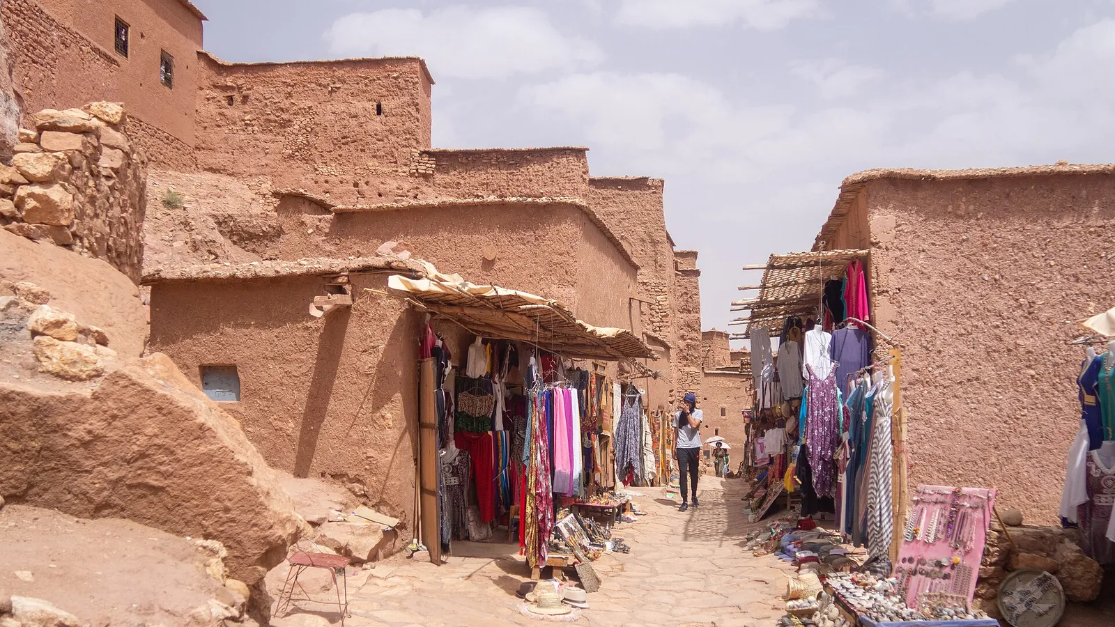 The earthen ksar of Aït Benhaddou climbing a hillside above a river in southern Morocco