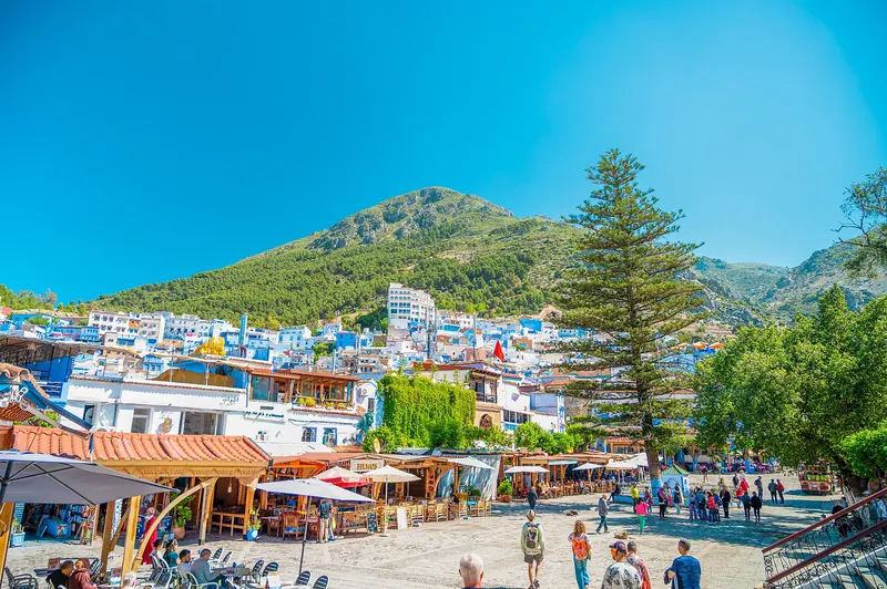 The blue houses of Chefchaouen with the Rif mountains rising behind