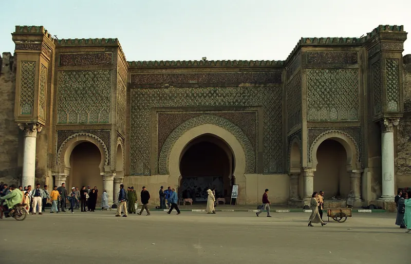 The ornate green-and-white tiled Bab Mansour gate in Meknes
