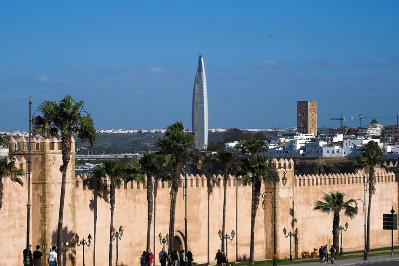 The walls of the Kasbah of the Udayas in Rabat with a modern tower behind