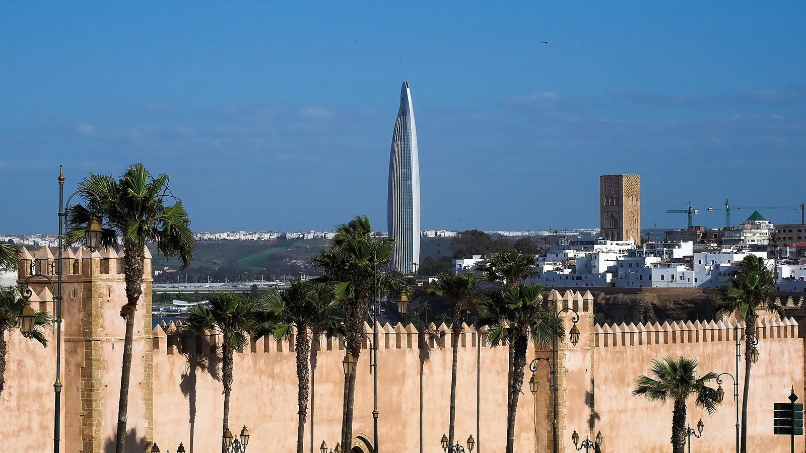 The walls of the Kasbah of the Udayas in Rabat with a modern tower behind