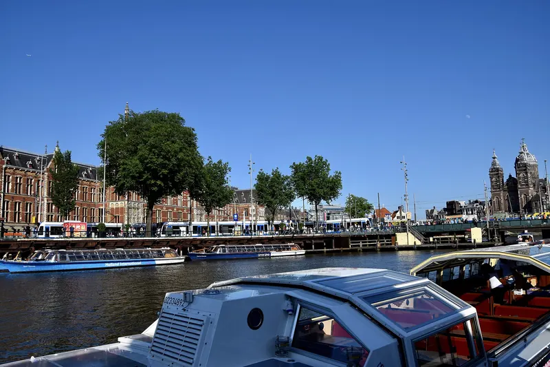 Narrow gabled houses along a canal in Amsterdam's historic centre