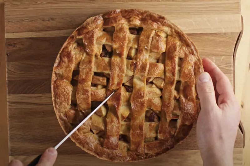 A slice of Dutch appeltaart, apple pie with whipped cream