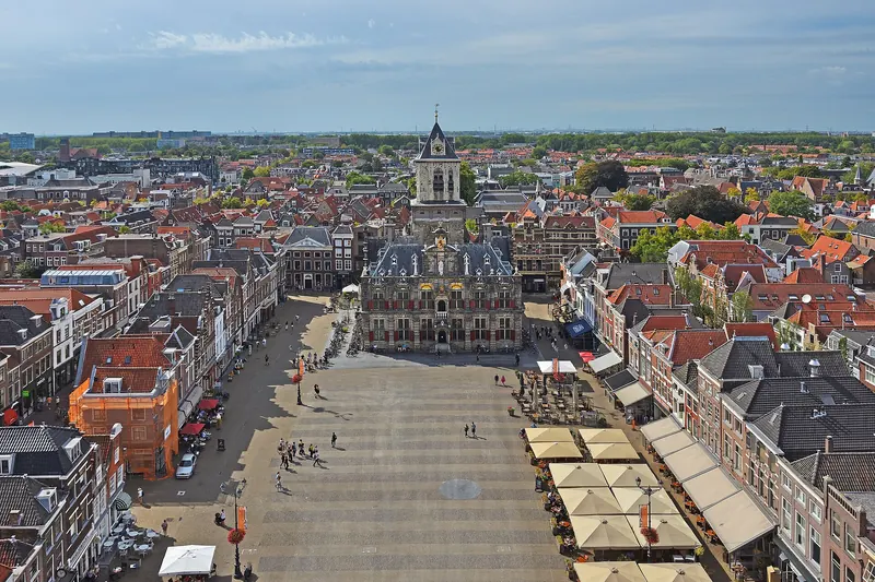 The Markt square in Delft, with the Nieuwe Kerk's spire rising above the historic buildings