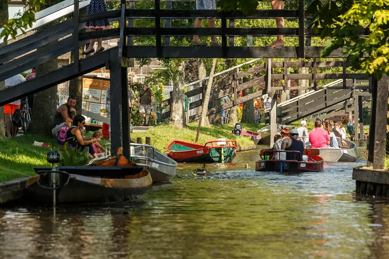 Thatched farmhouses along a canal in the car-free village of Giethoorn
