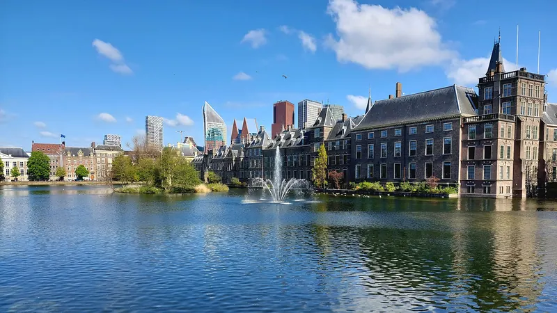 The Hofvijver lake reflecting the Binnenhof government buildings in The Hague