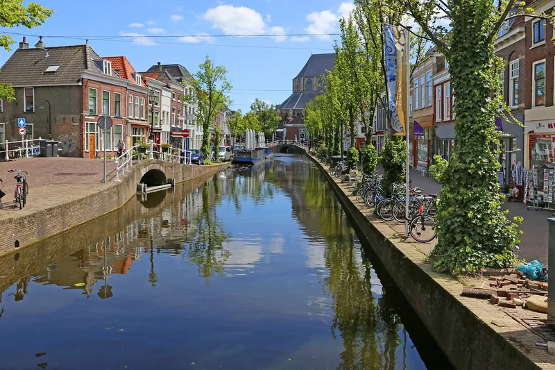 A canal lined with gabled houses in the historic centre of Delft