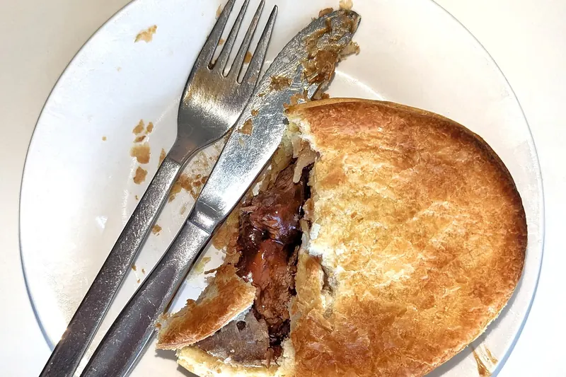 A classic New Zealand steak and cheese meat pie