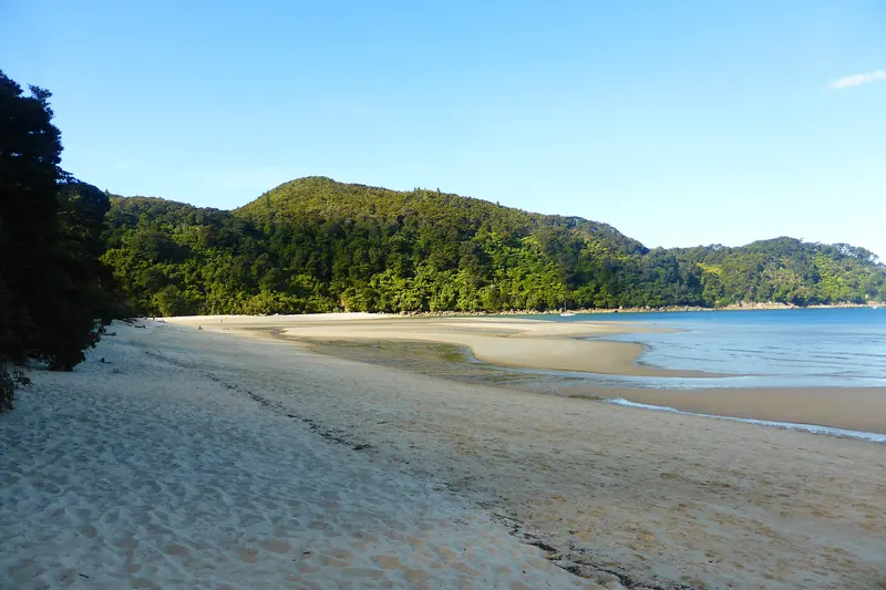 A kayak on the beach at Bark Bay in Abel Tasman National Park