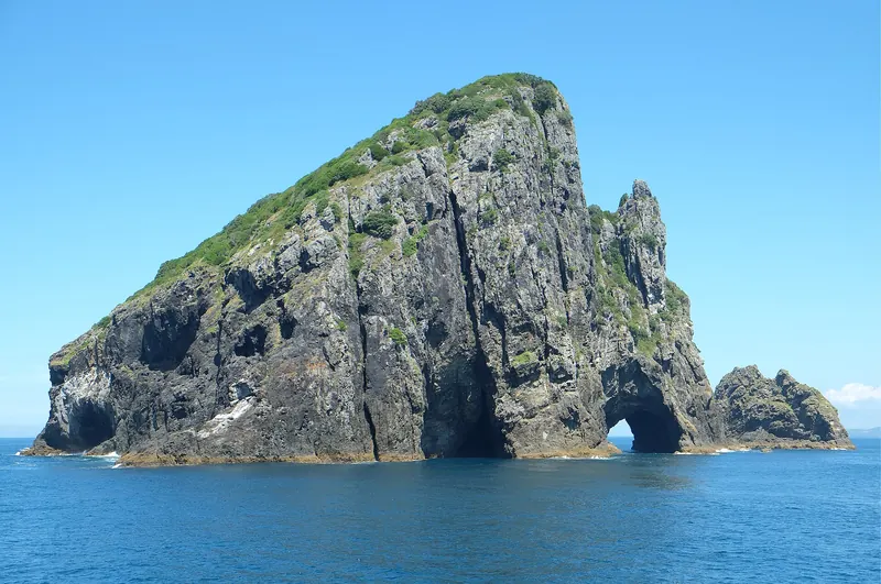 The Hole in the Rock, a natural arch through Motukokako Island in the Bay of Islands