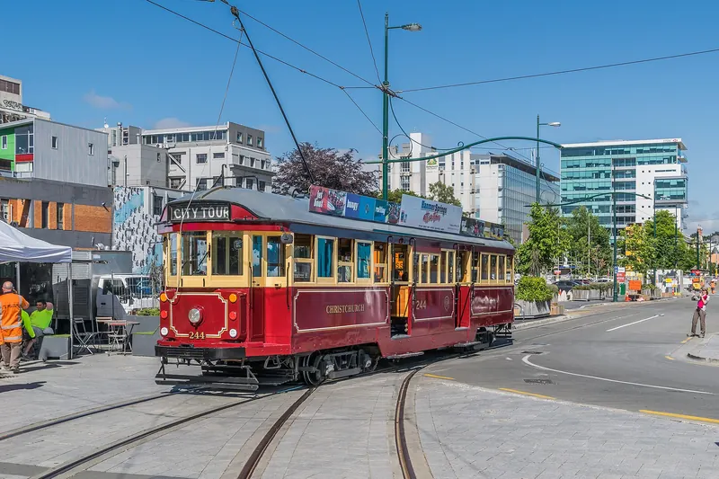 A historic tram passing through Cathedral Square in central Christchurch