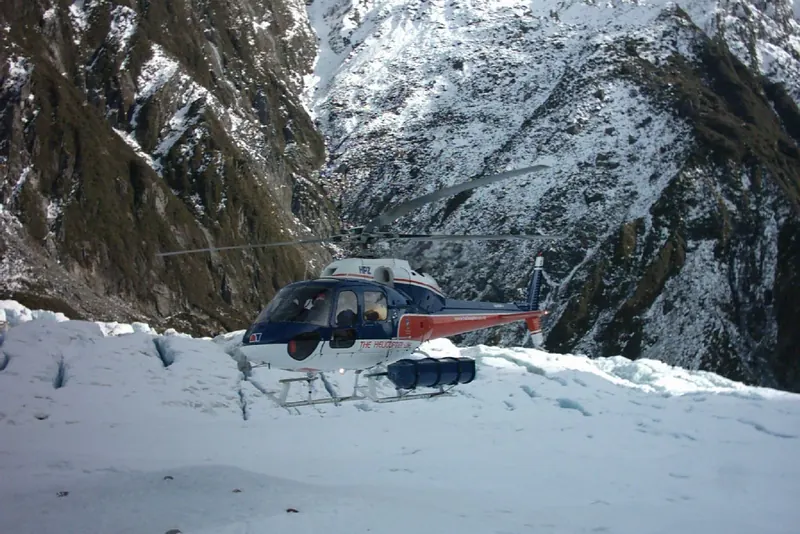 A helicopter landed on the ice for a glacier heli-hike