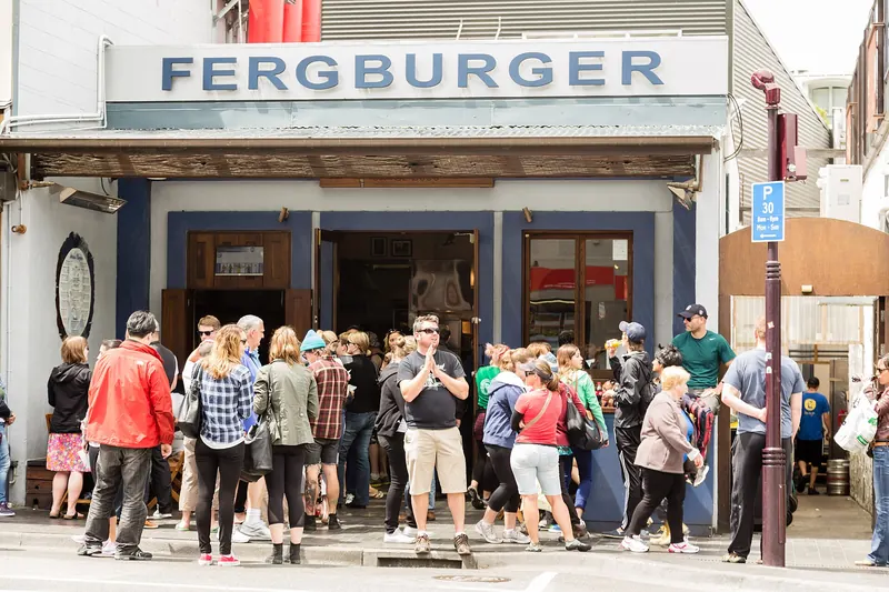 The famous Fergburger storefront in Queenstown, with its perpetual queue