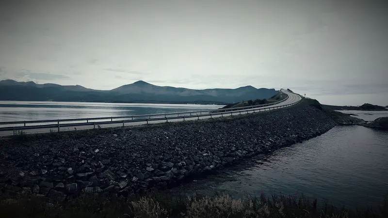 A car driving along the Atlantic Road beside the open sea