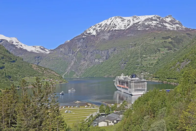 Geirangerfjord's sheer cliffs and calm water
