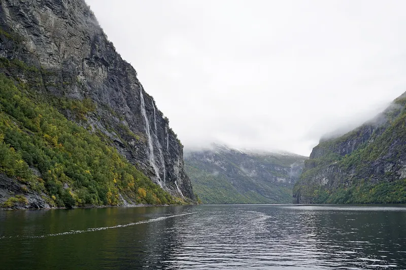 The Seven Sisters waterfall dropping in parallel streams into Geirangerfjord