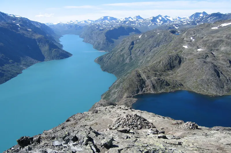 Hikers on the narrow Besseggen ridge trail