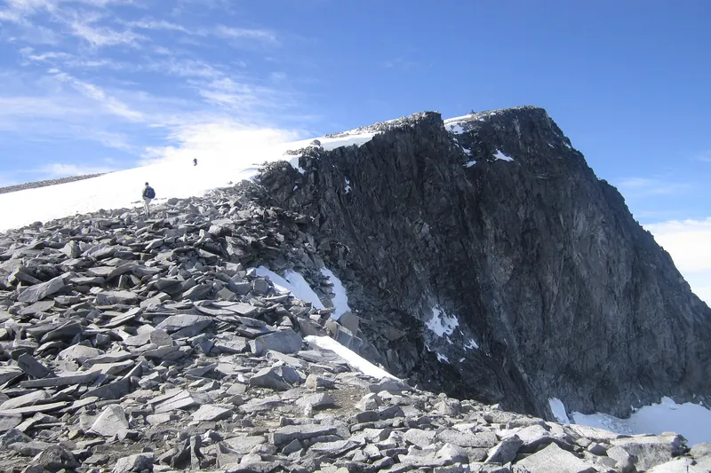 Hikers approaching the summit of Galdhøpiggen