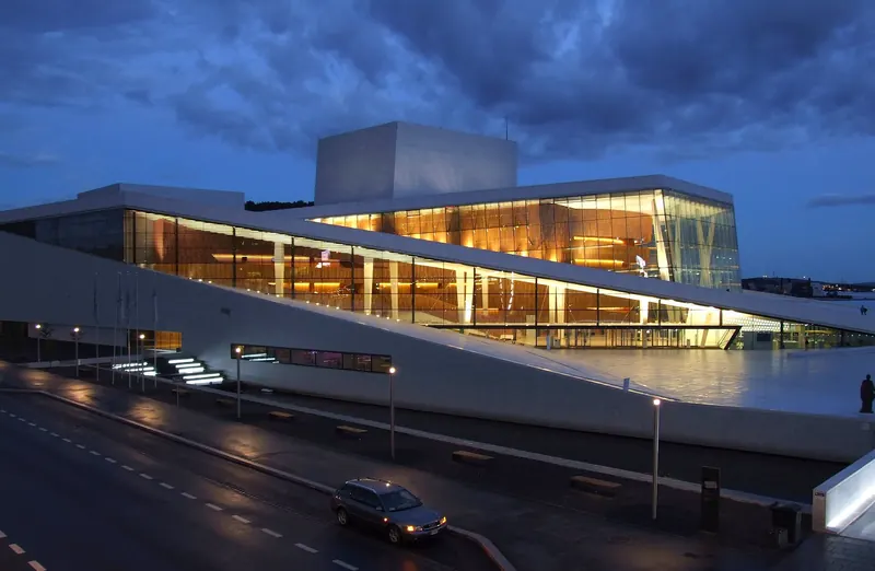 Visitors walking on the sloping roof of the Oslo Opera House