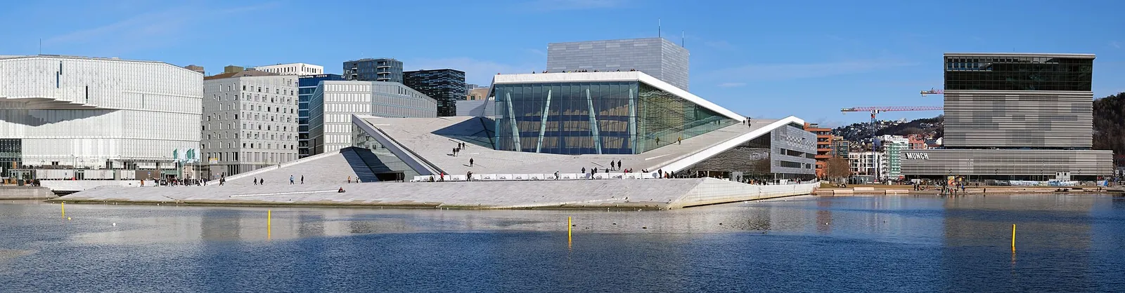 The Oslo Opera House rising from the harbour like a sheet of ice