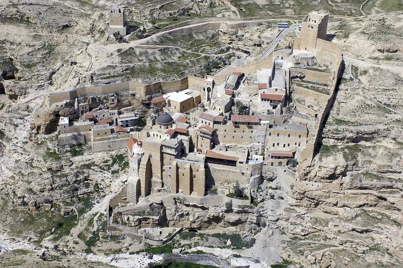 Aerial view of Mar Saba Monastery built into the Kidron Valley cliff