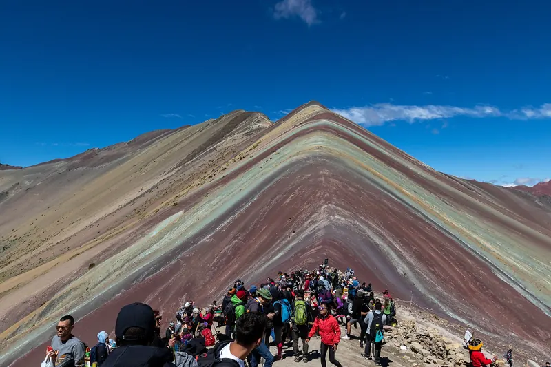 Hikers at the summit of Rainbow Mountain