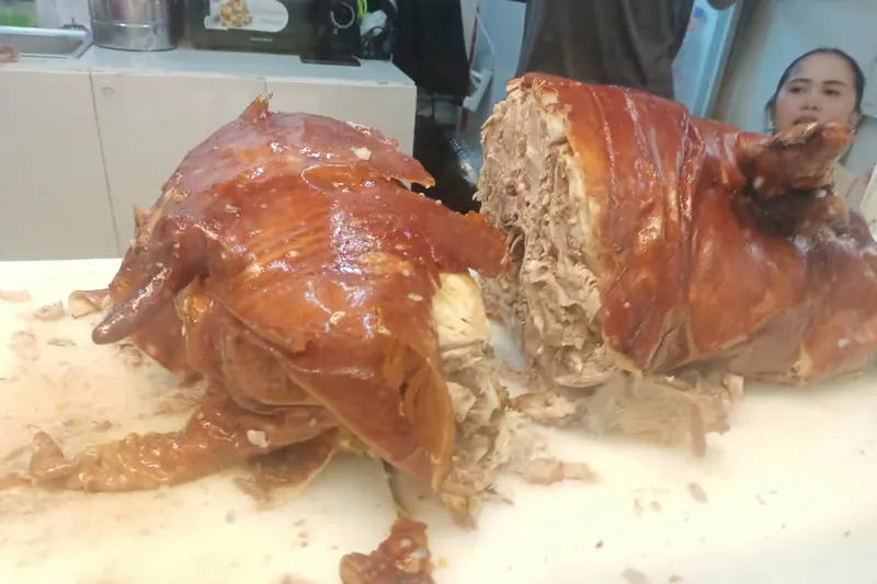 A whole roasted lechon pig with crackling skin in Cebu
