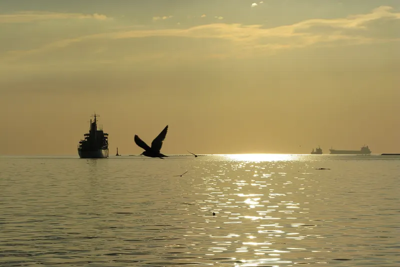 An orange sunset over Manila Bay from the boulevard