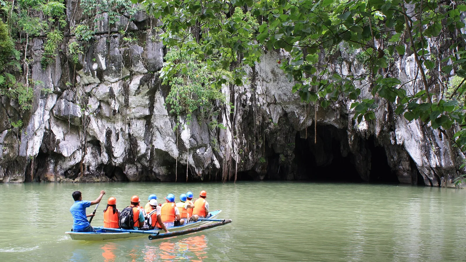 The entrance of the Puerto Princesa Underground River with a boat in the lagoon
