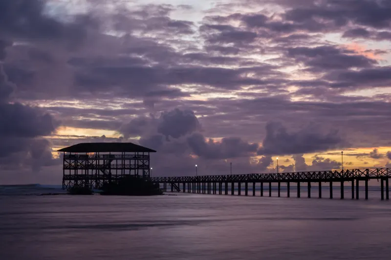 The wooden Cloud 9 boardwalk extending over the surf break