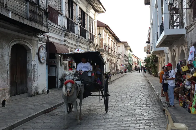 A horse-drawn calesa on the cobbled street of Calle Crisologo in Vigan