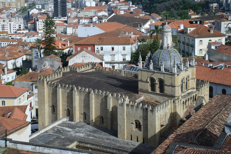 The fortress-like Romanesque Sé Velha cathedral seen from the university hill