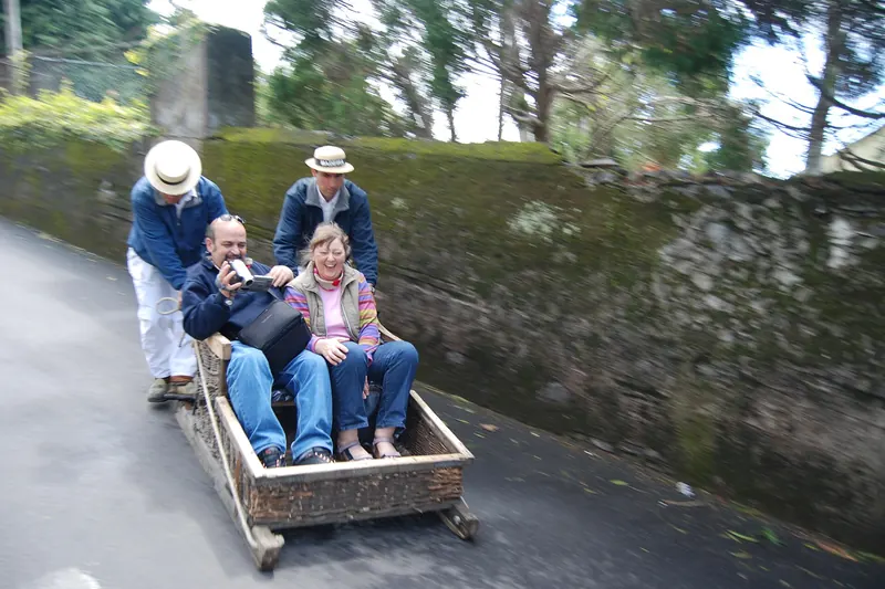 Traditional wicker toboggans (carros de cesto) and their drivers on the streets of Monte above Funchal