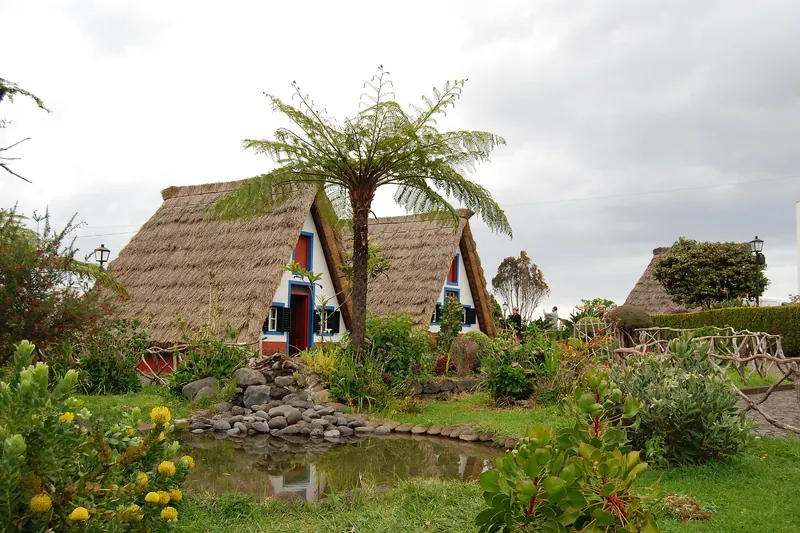 Colourful traditional A-frame thatched houses (palheiros) in Santana, northern Madeira
