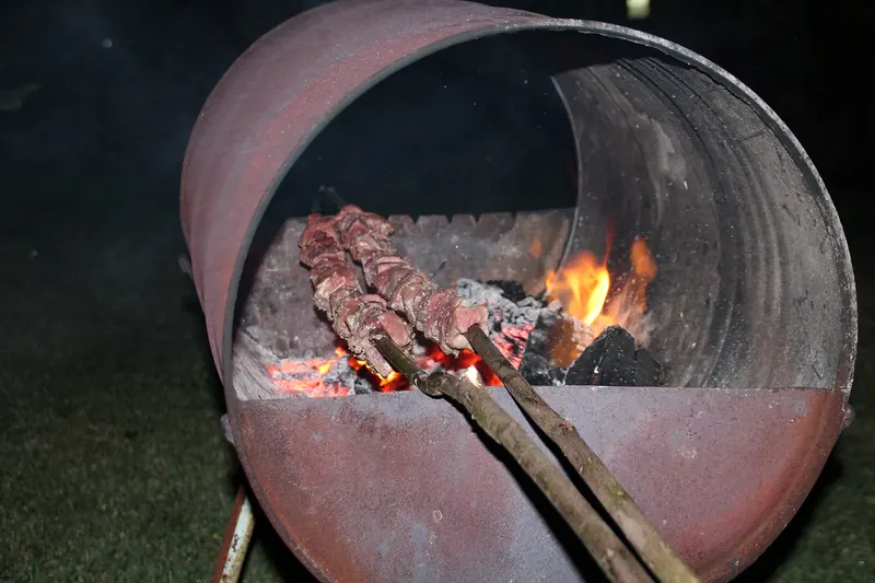 Espetada, chunks of beef skewered on a bay laurel stick and grilled