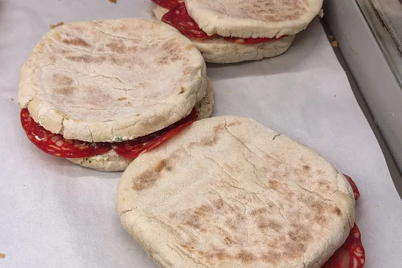 Bolo do caco, a round Madeiran griddle bread split and filled with garlic butter