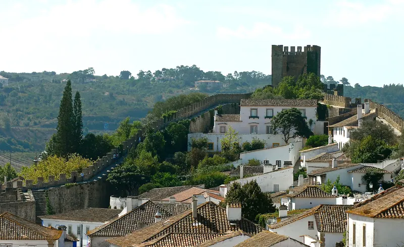 Óbidos's medieval castle walls surrounding the whitewashed old town
