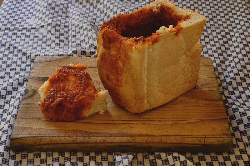 A bunny chow, curry served in a hollowed-out loaf of bread