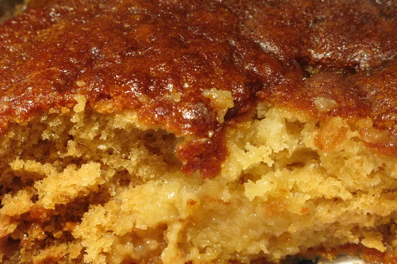 A warm malva pudding with custard