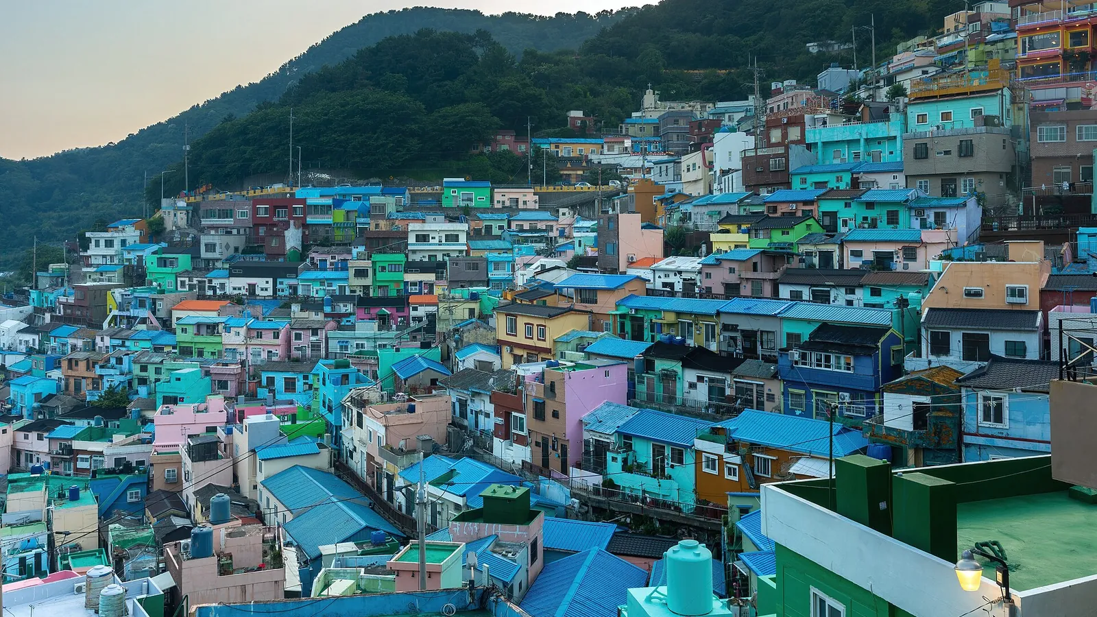 Colourful houses in Gamcheon Culture Village on a hillside at sunset