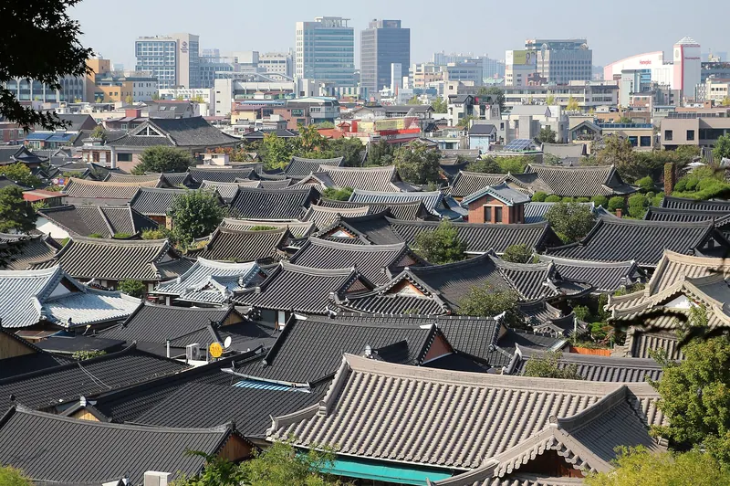 A lane in Jeonju Hanok Village lined with tile-roofed houses