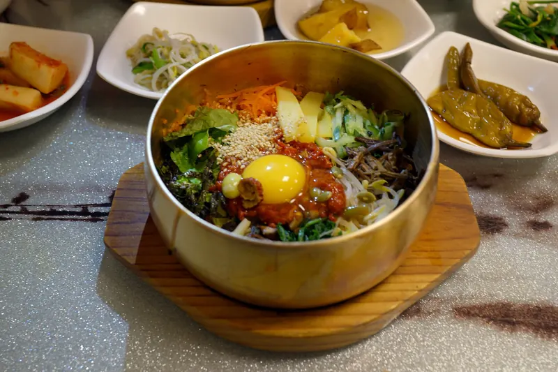 A bowl of Jeonju bibimbap with vegetables and egg