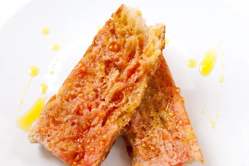 Bread rubbed with tomato, olive oil and salt