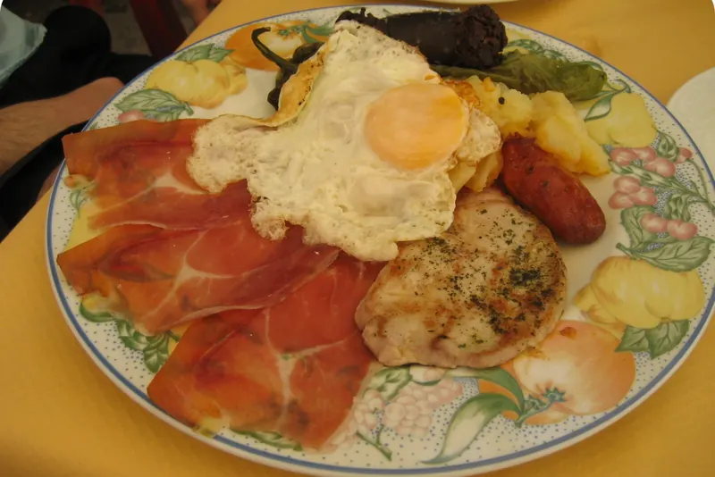 The plato alpujarreño — fried potatoes, morcilla, chorizo, ham and egg
