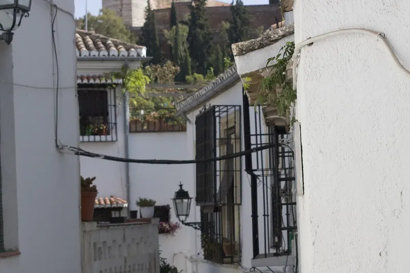 A narrow white-walled lane in the Albaicín