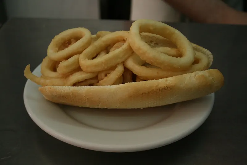 A bread roll filled with rings of fried squid